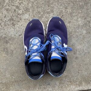 Purplish blue on cloud running shoes